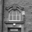 Arched window above  main entrance doorway, detail