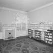 Second floor view of a bedroom with teapot and tea bowl collection.