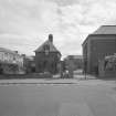 View of North gate and janitors house from West