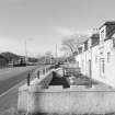 Inverness, Tomnahurich Swing Bridge over Caledonian Canal
Distant view of bridge from north east, with neighbouring terrace of houses (right)