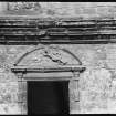 Detail of carved tympanum of window pediment.
