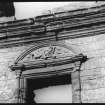 Detail of carved tympanum of window pediment.