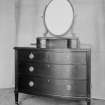 Chest of drawers with mirror.
