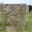 View of headstone, carved circles, figures and possible serpent, Muiravonside Parish Churchyard.