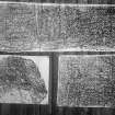 Photographic copy of three rubbings. The top rubbing shows detail of face of Rosiemarkie no.2  carved stone, Rosemarkie Parish Church. The bottom left rubbing shows detail from a fragmented Pictish symbol stone, originally from Newbigging Farm, Leslie, now in the garden of Leith Hall. The bottom right rubbing shows detail of face of  Farr cross-slab, Clachan.