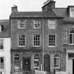 View of 6 Abbey Place, Jedburgh from south, showing T Cairncross confectioner and tobacconist.