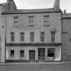 View of 19 Canongate, Jedburgh, from north showing J Dodds & Sons bakers and confectioners prior to reconstruction.