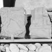View of Drainie no. 4 and no. 21 cross slab fragments on display in Elgin Museum.