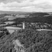 Oblique aerial view of Wallace Monument, Abbey Craig, Stirling, taken facing North.