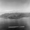 General View, Isle of Arran.  Ailsa Crag in background Saddell and Skipness, Argyll, Scotland. Oblique aerial photograph taken facing South/East. This image was marked by AeroPictorial Ltd for photo editing.