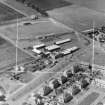 Newton Garage Kirriemuir, Angus, Scotland. Oblique aerial photograph taken facing West. This image was marked by AeroPictorial Ltd for photo editing.