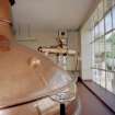 Alloa, Whins Road, Brewery, Brewhouse, lauter tun mezzanine floor area, interior
View showing Steeles Masher as it enters the Lauter Tun. This was added in 1986 when Castlemaine 4X lager began to be brewed on site under licence to Perkins of Brisbane, Australia. Grain stored in Grist Case 2 (which sits on roof of brewhouse) is fed by conveyor to the Steeles Masher. The grist is mixed here with water from Mash Tun no.2 into a thick consistency. More hot liquor is then pumped in from Mash Tun no. 2. The liquid sugar tanks are situated below this area