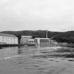 Islay, Caol Ila Distillery.
View from SE (from sea) of still house and other production buildings forming the N part of the distillery complex