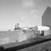 Bowmore Distillery
View from W showing the roofs of the two kilns, and the gables of the neighbouring floor maltings