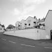 Bowmore Distillery
View from N in E yard, showing E gables of the maltings block (centre), and part of the visitors' centre (right)