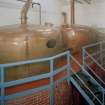 Bowmore Distillery
Interior view within mash house showing copper hot water tanks