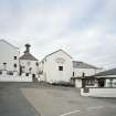 Bowmore Distillery
View from NE across E yard of distillery, showing NE side of maltings and kilns, the mash house and tun room, and (right) the visitors' centre.  Bowmore distillery is one of only two distilleries on Islay that continues to floor-malt its barley