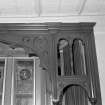 Ground floor, bar (former drawing room), window, decorative wooden screen, archway, detail