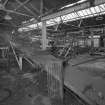Newtongrange, Lady Victoria Colliery, Pithead Building (tub Circuit, Tippler Section, Picking Tables)
Interior view from NW at first-floor level showing conveyor leading from Picking Tables into the Dense Medium Plant (left)