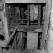 Detail of threshing machine in barn.