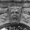 Archway (no.40 on plan), close detail of carved head at centre of arch.