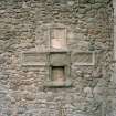 Detail of cruciform in wall of sacrament house.