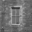 SW corner, stone window surround, detail