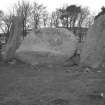 View of Stonehead recumbent and flanking stones; Mr J R Sherriff (RCAHMS) is shown taking notes.