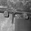 Interior.
Detail of several chutes leading from storage hoppers in the kiln roof.  Undried grain is fed through these chutes when loading the kiln floor.