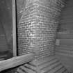 Interior.
Detailed view of brick-built kiln invert, through which heat from the firebox to rear is funnelled up to the perforated-iron kiln floor above.