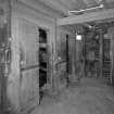 Interior.
View of basement of mill, showing gear cupboard, mostly obscured behind wooden panelling.