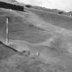 Excavation photograph : area E - ditch section from SE.