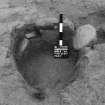 Excavation photograph : area B - f010, posthole with packing fro ENE.
