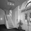Interior. View of entrance lobby from East showing original stair to galleries