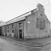 Oblique view of the rear of the former wash house seen from the South West.