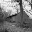 View from W of outbuilding to N.