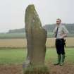 View of rubbing stone from SW, with Dr Iain Fraser (RCAHMS) in picture
