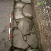 Detail of paving at N end of the excavation trench. Scale in 200mm divisions