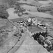 Distillery at Tomatin, Craig Morile, Moy and Dalarossie, Inverness-shire, Scotland, 1950. Oblique aerial photograph taken facing west.