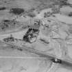 Distillery at Tomatin, Craig Morile, Moy and Dalarossie, Inverness-shire, Scotland, 1950. Oblique aerial photograph taken facing south.