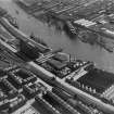Glasgow, general view, showing Robinson Dunn and Co. Ltd. Partick Saw Mills and Meadowside Granary, Linthouse, Govan, Lanarkshire, Scotland, 1930.  Oblique aerial photograph taken facing south. Oblique aerial photograph  taken facing south-east.