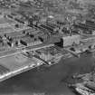 Glasgow, general view, showing Robinson Dunn and Co. Ltd. Partick Saw Mills and Meadowside Granary, Linthouse, Govan, Lanarkshire, Scotland, 1930.  Oblique aerial photograph taken facing south. Oblique aerial photograph  taken facing north-east. This image has been produced from a marked negative.