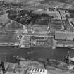 Glasgow, general view, showing Robinson Dunn and Co. Ltd. Partick Saw Mills and Meadowside Granary, Linthouse, Govan, Lanarkshire, Scotland, 1930.  Oblique aerial photograph taken facing south. Oblique aerial photograph  taken facing north. This image has been produced from a marked negative.