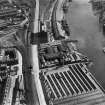 Glasgow, general view, showing Robinson Dunn and Co. Ltd. Partick Saw Mills and Meadowside Granary, Linthouse, Govan, Lanarkshire, Scotland, 1930.  Oblique aerial photograph taken facing east. Oblique aerial photograph  taken facing north. This image has been produced from a marked negative.