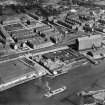 Glasgow, general view, showing Robinson Dunn and Co. Ltd. Partick Saw Mills and Meadowside Granary, Linthouse, Govan, Lanarkshire, Scotland, 1930.  Oblique aerial photograph taken facing north-east. Oblique aerial photograph  taken facing north. This image has been produced from a marked negative.