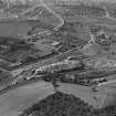 Robinson Dunn and Co. Ltd. Temple Saw Mills and High Knightswood Housing Estate, New Kilpatrick, Dunbartonshire, Scotland, 1930.  Oblique aerial photograph taken facing west. This image has been produced from a damaged negative.