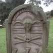 Detail of headstone 1768 showing winged soul and symbols of mortality, Whittingehame Parish Church Burial Ground.