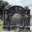 View of headstone to Thomas Graham d. 1769 with farmer and  Green Man, Livingston Parish Churchyard.