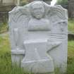 View of headstone 1746 with winged soul and smith's tools, Muirkirk Parish Churchyard.