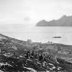 St Kilda Village.
General view from North West across the bay with steamer at anchor; including Store, School, Church and Manse and group of people in foreground.